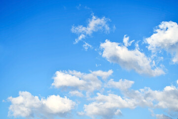 Blue sky with white fluffy cloud. Cumulus clouds background. Cloudscape morning sky. The concepts of freedom of life, never give up and positive though energy.