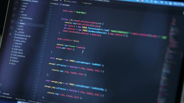 Close-up of coding on a computer screen. Programmers create code for apps and websites.