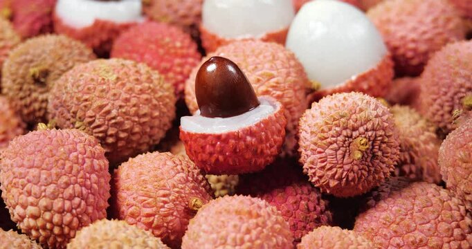 Lychee Exotic Fruit Rotating Background. Harvested Litchi Fruits or Berries. Asian food