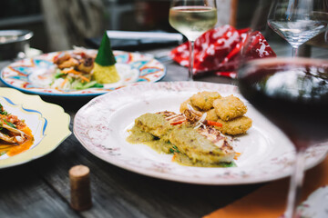 Served table with delicious food and wine