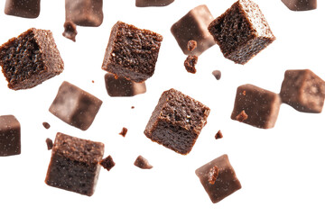 Brownie Squares Descending Mid Air  isolated on a transparent background
