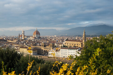 View of Florence Cathedral (Cattedrale di Santa Maria del Fiore) and rest of Florence from Michelangelo plaza at golden hour. Panoramic view of Florence, Tuscany, Italy © Lizaveta