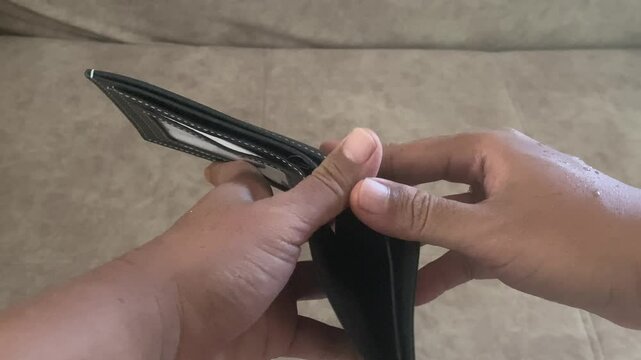 business money wallet cash finance open holding economy poor financial. credit empty poverty hand showing debt sad broke bankruptcy leather. person purse savings crisis problem pay payment bankrupt.