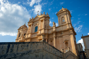 Facade of the Cathedral of St. Nicholas of Noto, Sicily, Italy, a UNESCO World Heritage Site, in the golden light of sunset