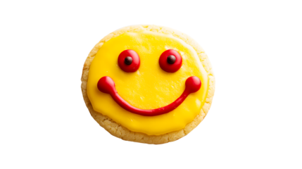 A cookie with a yellow icing and red frosting on it with a smiling face