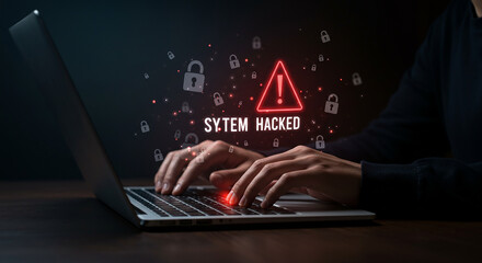 A person typing on a laptop with a system hacked alert and lock icons floating around the screen space