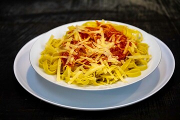 Authentic fettuccine or tagliatelle with tomato sauce and grated parmesan. real food