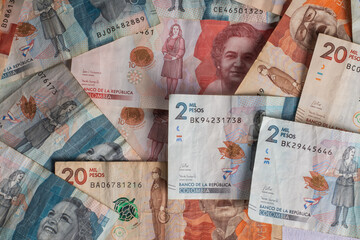 Pile of Mixed Colombian Bills Spread on a Table