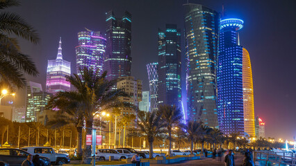 The skyline of Doha by night with starry sky seen from Corniche timelapse, Qatar