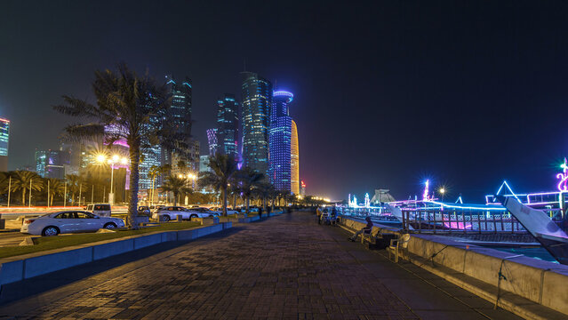 The skyline of Doha by night with starry sky seen from Corniche timelapse hyperlapse, Qatar
