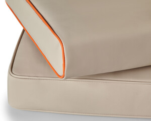 Two beige leather cushions with orange piping detailing