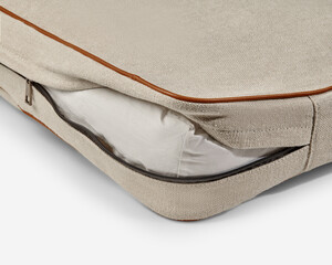 Close-up of removable washable cushion cover with zipper on pet bed © nazarovsergey