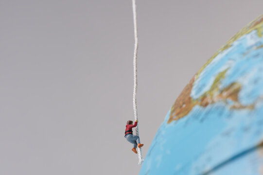 Mountaineer abseils near the globe