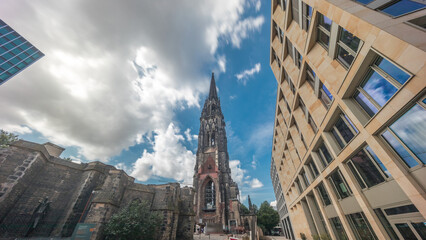Looking up perspective to the facade of Ehemalige Hauptkirche St. Nikolai timelapse hyperlapse in...