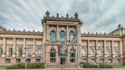Fototapeta premium Hyperlapse of Hanover's Lower Saxony State Museum with passing traffic and people in front of its historic facade. Germany