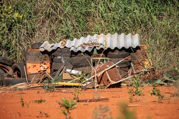 Rustic background with brass drums pierced by gunshots