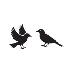 Obraz premium Silhouette of Two Birds Facing Each Other.Simple black silhouette of two birds, one with outstretched wings, facing each other.