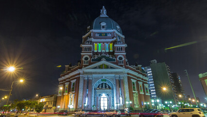 Exterior of the Immaculate Heart of Mary Church illuminated at night timelapse hyperlapse. Lima, Peru
