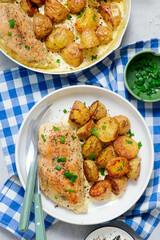 Chicken breast and potatoes in a creamy sauce.top veiw