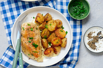 Chicken breast and potatoes in a creamy sauce.top veiw