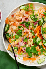 Rice bowl with shrimps, vegetables and spicy mayonnaise.top veiw