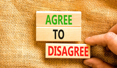 Agree to disagree symbol. Concept words Agree to disagree on beautiful wooden block. Businessman's...