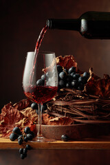 Wine is poured into a glass.