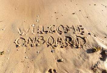 Business welcome onboard concept. Concept word Welcome onboard written on beautiful Red sea sand beach. Beautiful Red sea ocean sand beach background, copy space. Business welcome onboard concept.