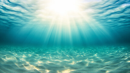 Fototapeta premium Sunlight illuminating clear turquoise ocean water with sandy seabed in a tranquil underwater scene