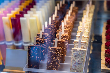 Ice cream popsicles displayed in ice cream shop window