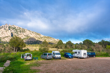 Camper vans parked near montserrat massif in catalonia, spain