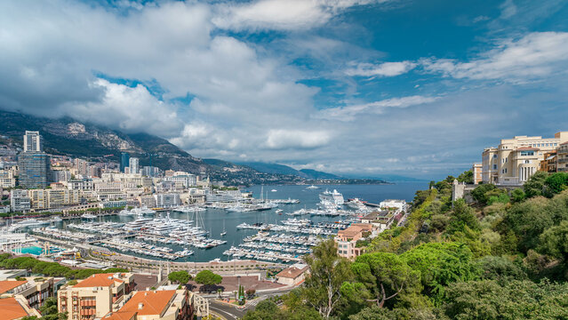 Monte Carlo city aerial panorama timelapse. View of luxury yachts and apartments in harbor of Monaco, Cote d'Azur.