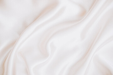 Soft white fabric draped gracefully on a surface for textile design inspiration