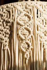 Intricate macrame textile design featuring unique knots and patterns crafted with natural fibers