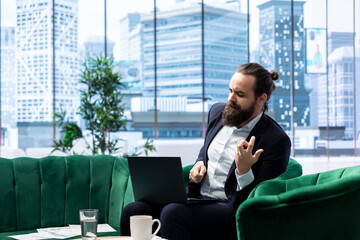 Proud satisfied CEO mimics air guitar singing and celebrating achievement, feeling happy with the...