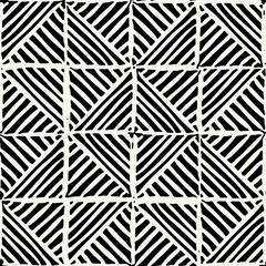 Vector seamless pattern. Linocut abstract triangles. Graphic hand drawn background. Stamped monochrome texture. Repeating print with hatched triangles.