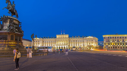 Fototapeta premium Mariinsky palace and monument to Nikolay I from Isaac's square day to night timelapse hyperlapse. Saint-Petersburg, Russia