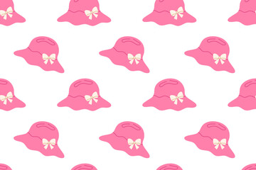 Seamless pattern with pink hats and beige bows on white background