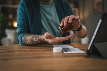 One adult man drink medicine drug tablet or supplement vitamin at home