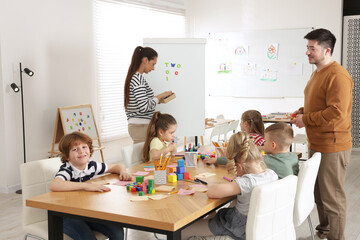 Children and teachers during lesson in school
