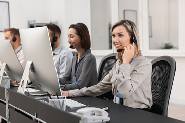 Technical support call center. Team of operators working in office