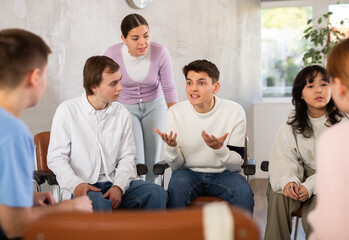 Fototapeta premium Group of students studying for difficult test in studygroup together