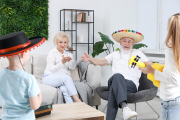 Grandparents and their grandkids having fun together at home