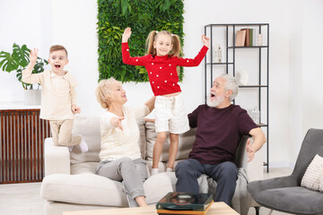 Grandparents and their grandkids spending time together at home