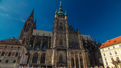 Fototapeta premium St. Vitus Cathedral timelapse hyperlapse in Prague surrounded by tourists.