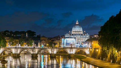 Fototapeta premium St. Peter's Basilica, Saint Angelo Bridge and Tiber River after the sunset day to night timelapse