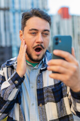 Happy shocked excited Caucasian mature man tourist in casual clothes mouth opened celebrate victory...