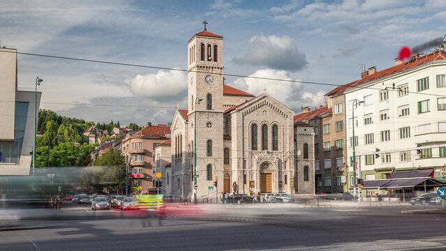 City traffic and people on the cross walk in front of Saint Joseph's Church on Titova street timelapse hyperlapse in Sarajevo, Bosnia - Powered by Adobe