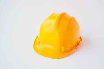 Fototapeta premium Yellow colored worker's hard hat,helmet on white background