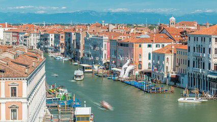 Top view on central busy canal in Venice timelapse, on both sides masterpieces of Venetian architecture
